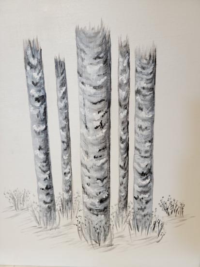 Birch trunks with tiny flowers a bases