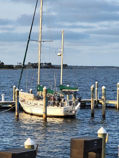 Sailboat moored at dock